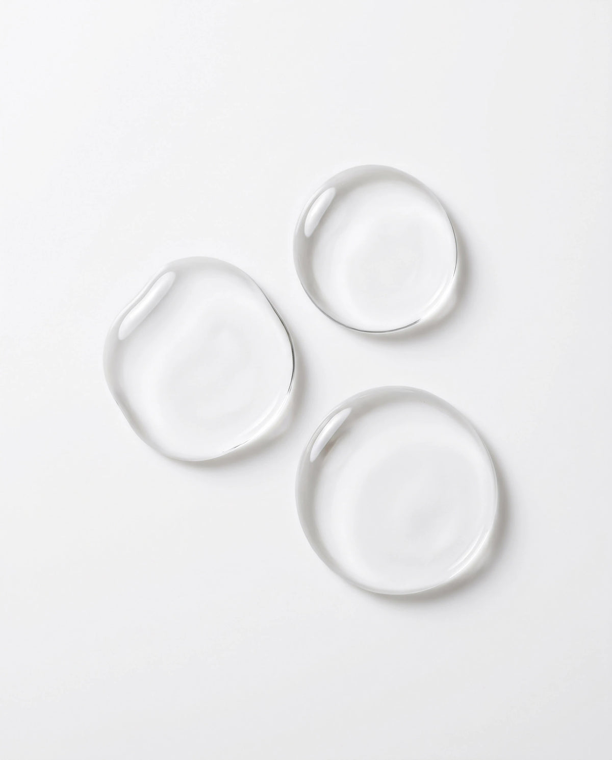 Cleansing Oil No. 1 texture, clear oil droplets on white