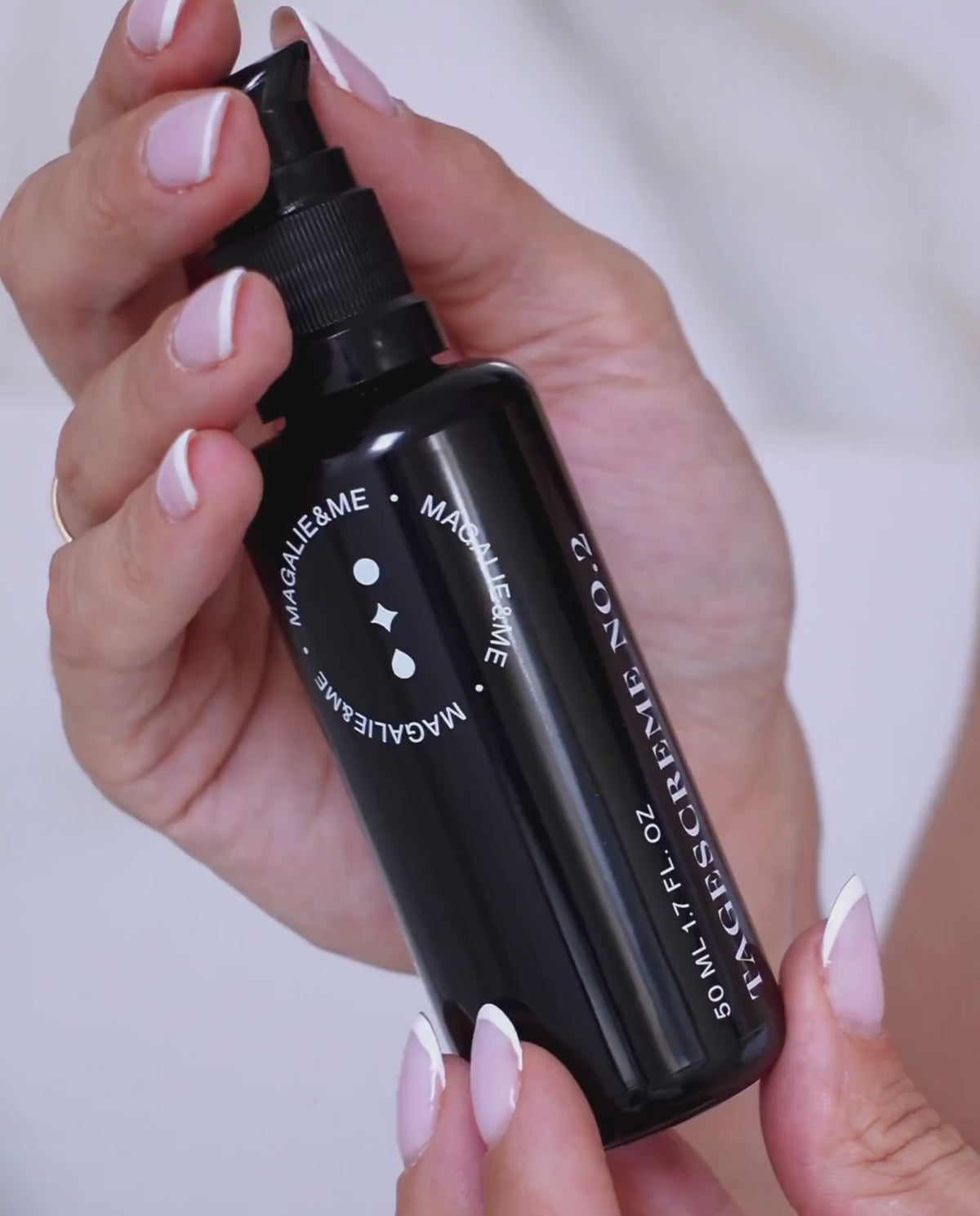 Hands holding Radiance Repair Day Cream No. 2